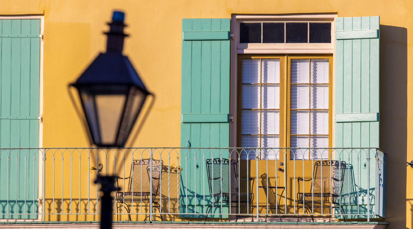 A scene of a New Orleans balcony and streetlight.